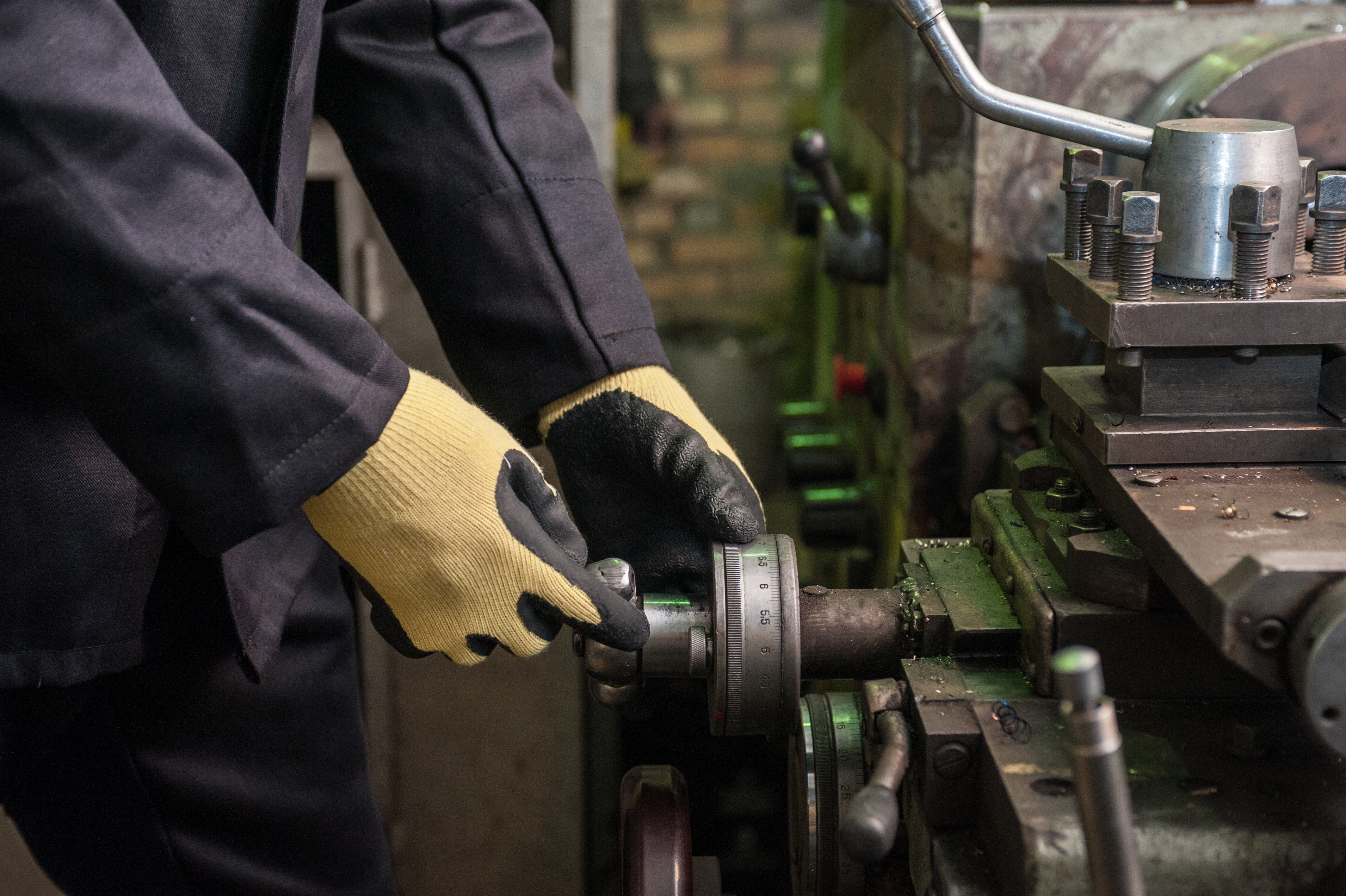 worker in protective gloves